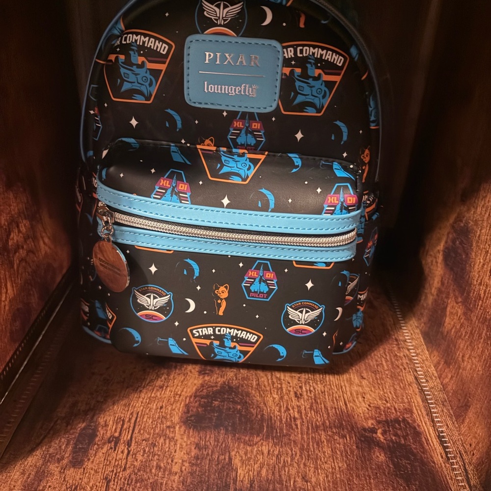 Loungefly Pixar Star Command Backpack - Black with Blue and Orange Accents